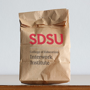 Graphic of a brown bad with the SDSU Interwork Institute logo