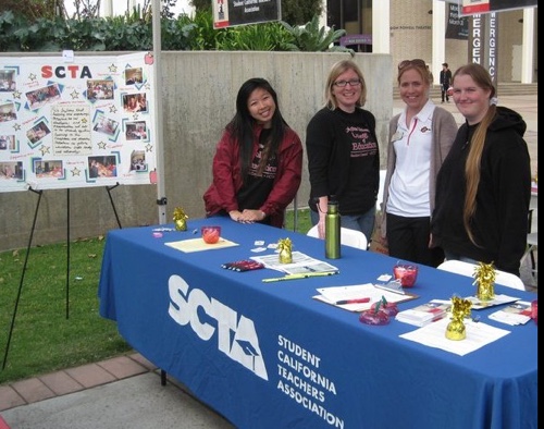 Photo of several SCTA members tabling outdoors on campus 