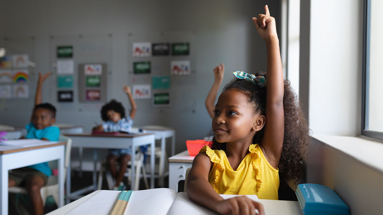 Schoolgirl raising her hand