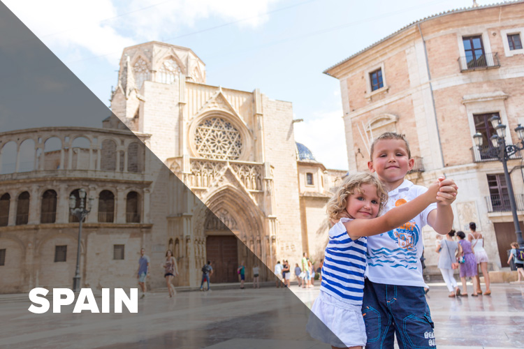 two children, girl and boy, in Spanish square