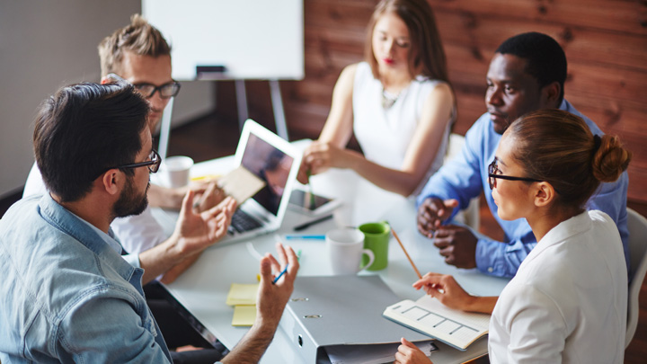 group of professionals discussing at a table