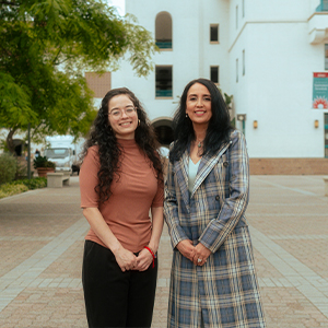 Assistant professor Wendy Ochoa (left) and Rosie Villafana-Hatcher, director of the Early Assessment Program, posed on Centennial Walkway.