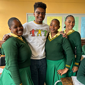 Wesley Cox with students in South Africa.