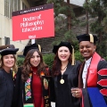 Graduate students from the Class of 2025 celebrate outside Viejas Arena.
