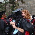 Graduate students from the Class of 2025 celebrate outside Viejas Arena.