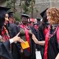 Graduate students from the Class of 2025 celebrate outside Viejas Arena.