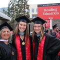 Graduate students from the Class of 2025 celebrate outside Viejas Arena.