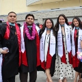Graduate students from the Class of 2025 celebrate outside Viejas Arena. 