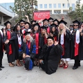 Graduate students from the Class of 2025 celebrate outside Viejas Arena. 