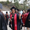 Graduate students from the Class of 2025 celebrate outside Viejas Arena. 