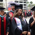 Graduate students from the Class of 2025 celebrate outside Viejas Arena. 