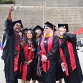 Graduate students from the Class of 2025 celebrate outside Viejas Arena. 