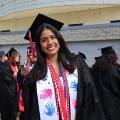 A student from the Class of 2025 celebrates outside Viejas Arena.