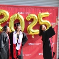 Undergraduate students from the Class of 2025 celebrate outside Viejas Arena.