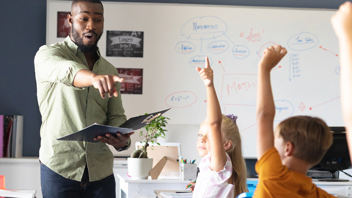 black male teacher in classroom